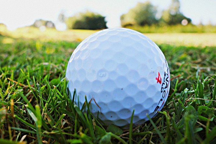 Golf ball on the green.