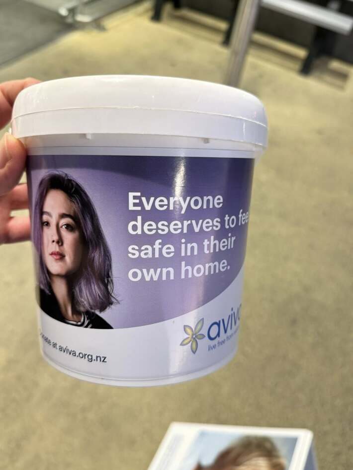 An Aviva donation bucket with the words, "Everyone deserves to feel safe in their own home"